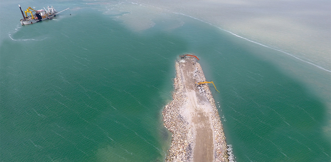 At the end of the main breakwater under construction