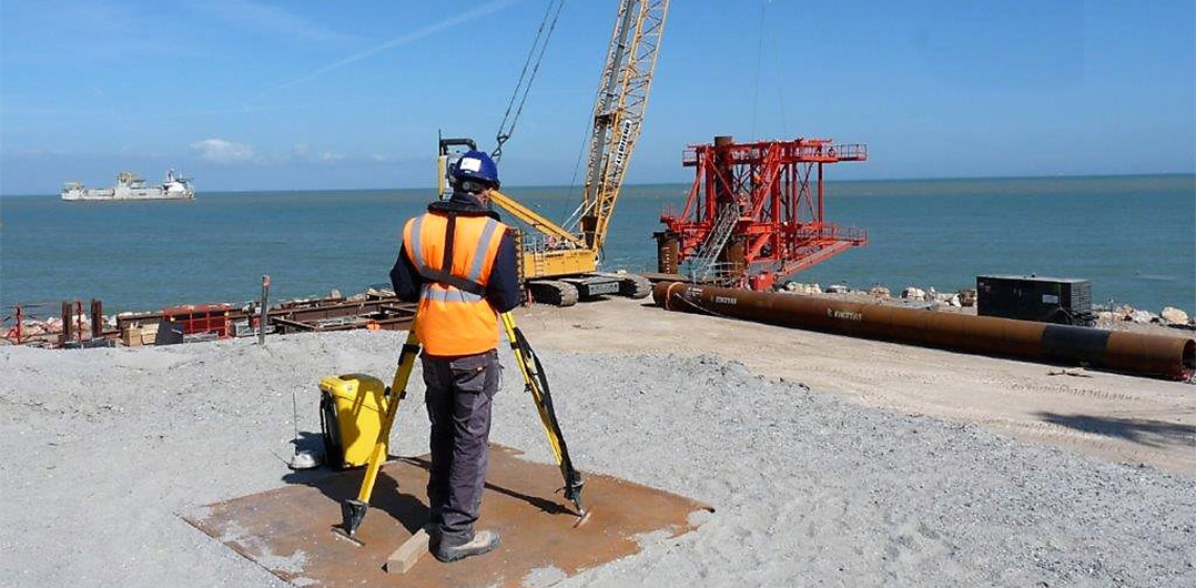 A surveyor on the Eastern inner embankment